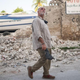 2021 earthquake.José Andrés walking through rubble from collapsed building remains in Haiti after a 2021 earthquake.